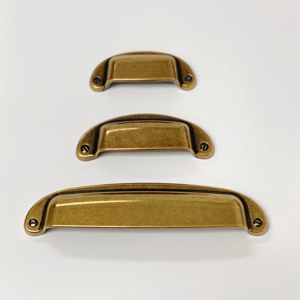 Drawer Cup Pull "Capri" in Antique Brass