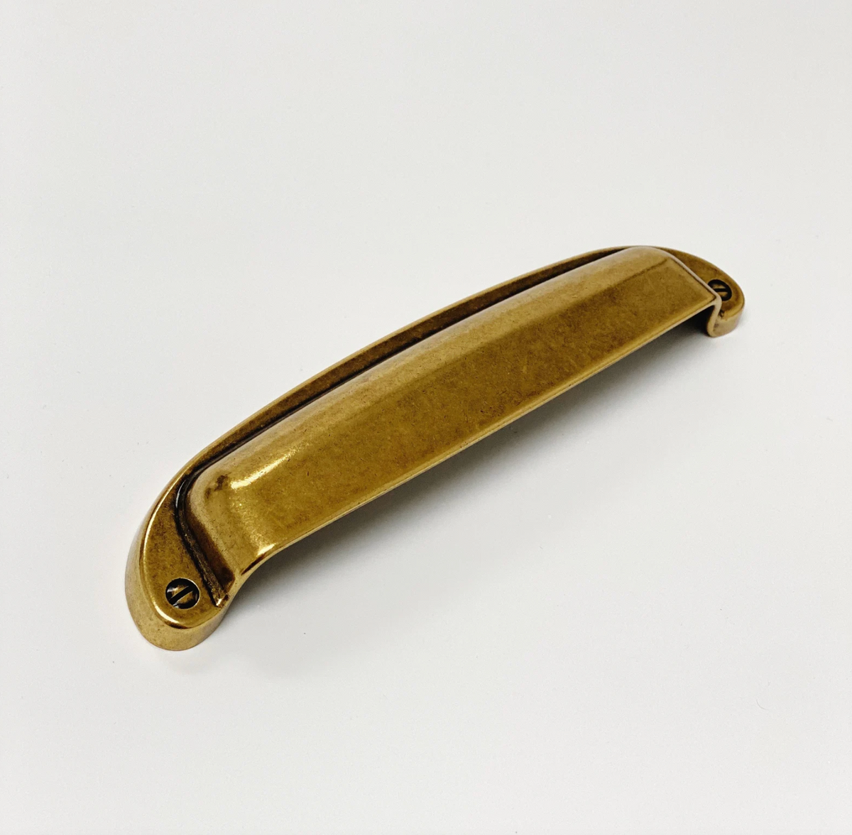 Drawer Cup Pull "Capri" in Antique Brass